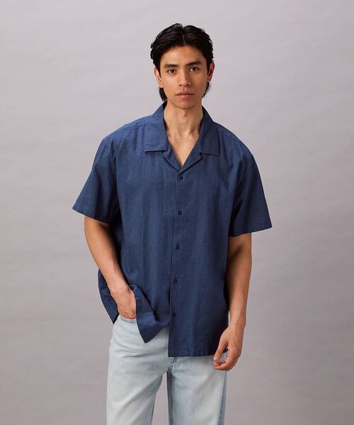 Calvin Klein(カルバン・クライン)の「ソリッドショートスリーブシャツ(シャツ/ブラウス・メンズ・ダークブルー/ホワイト・XL/S/M/L)」の1枚目の写真