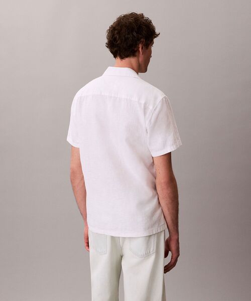 Calvin Klein(カルバン・クライン)の「ソリッドショートスリーブシャツ(シャツ/ブラウス・メンズ・ダークブルー/ホワイト・XL/S/M/L)」の11枚目の写真
