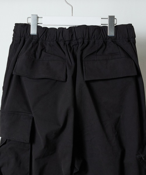 NUMBER (N)INE(ナンバーナイン)の「HAND PAINTED MULTI POCKET CARGO PANTS / ハンドペイント マルチ ポケット バックル ベルト ウエストゴム カーゴパンツ(カーゴパンツ・メンズ・ブラック/オリーブ・2/3/4)」の10枚目の写真