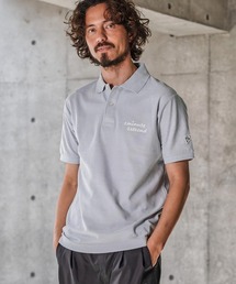 1minute 1second（ワンミニットワンセカンド）の「mhs2567-cursive print polo shirt ポロシャツ(1M26N290)（ポロシャツ）」