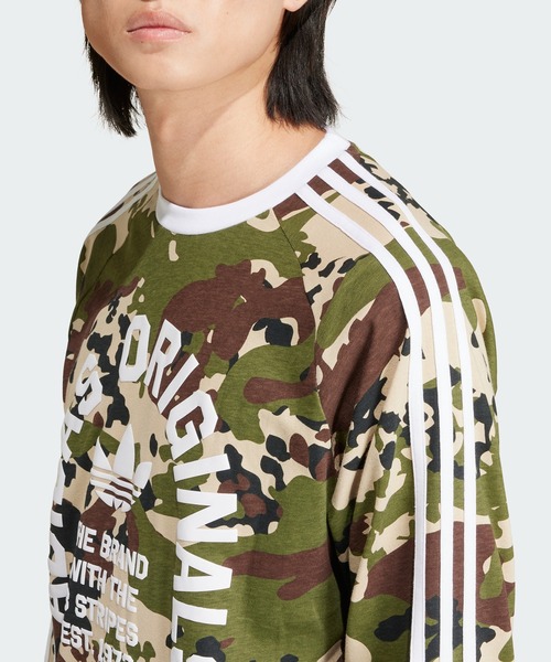 adidas（アディダス）の「カモ柄 長袖 カリTシャツ / ロンT