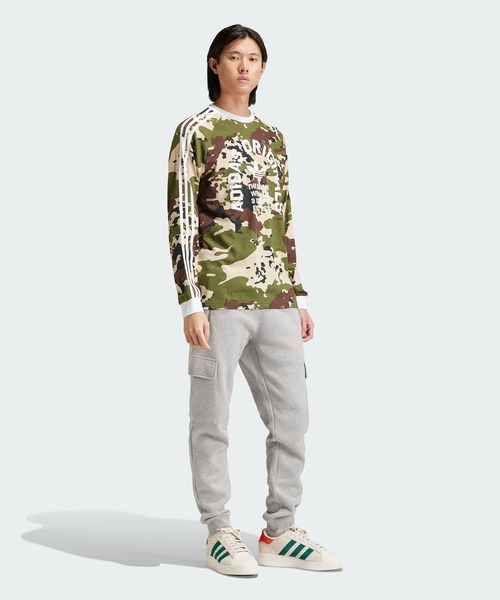 adidas（アディダス）の「カモ柄 長袖 カリTシャツ / ロンT