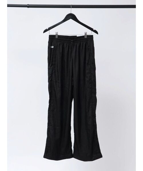 PUMA(プーマ)の「【PUMA】PUMA X ROSE T7 Relaxed Track Pants WV(その他パンツ・レディース・ブラック・SMALL/MEDIUM)」の1枚目の写真