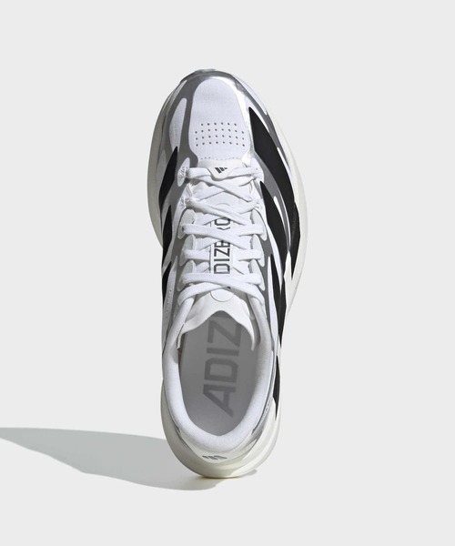 adidas(アディダス)の「アディゼロ EVO SL EXO / Adizero EVO SL EXO Shoes / ランニングシューズ / アディダス adidas(スニーカー・レディース・ホワイト×ブラック・23.0cm/23.5cm/24.0cm/24.5cm/25.0cm/25.5cm/22.0cm/22.5cm/26.0cm)」の2枚目の写真