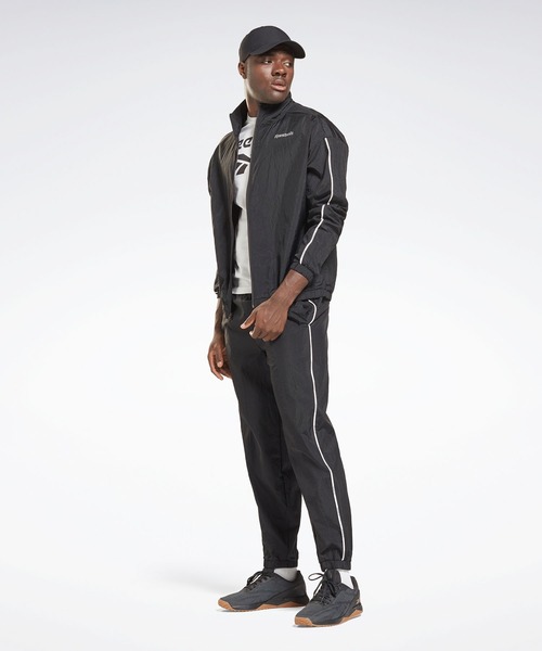 Reebok(リーボック)の「トレーニング エッセンシャルズ パイピング トラック スーツ / Training Essentials Piping Track Suit(ジャージ・メンズ・ブラック/ブルー/グレー・SMALL/MEDIUM/LARGE/X-LARGE/XX-LARGE/X-SMALL/XXX-LARGE)」の6枚目の写真
