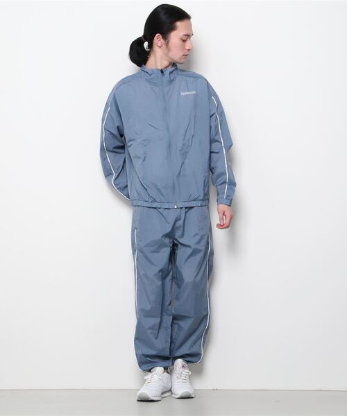 Reebok(リーボック)の「トレーニング エッセンシャルズ パイピング トラック スーツ / Training Essentials Piping Track Suit(ジャージ・メンズ・ブラック/ブルー/グレー・SMALL/MEDIUM/LARGE/X-LARGE/XX-LARGE/X-SMALL/XXX-LARGE)」の17枚目の写真