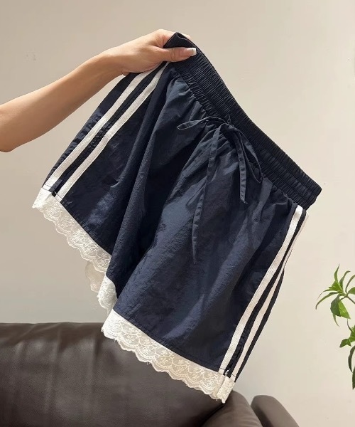 Teem Store(チームストア)の「サイドラインデザインレース付きナイロンショートパンツ(その他パンツ・レディース・ネイビー・M/L)」の7枚目の写真
