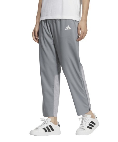 adidas(アディダス)の「アディダス adidas アディダスアダプテーション ドット エア クロス レギュラーフィット 9/10 パンツ(その他パンツ・レディース・グレー/ブラック・S/M/L/XL)」の1枚目の写真