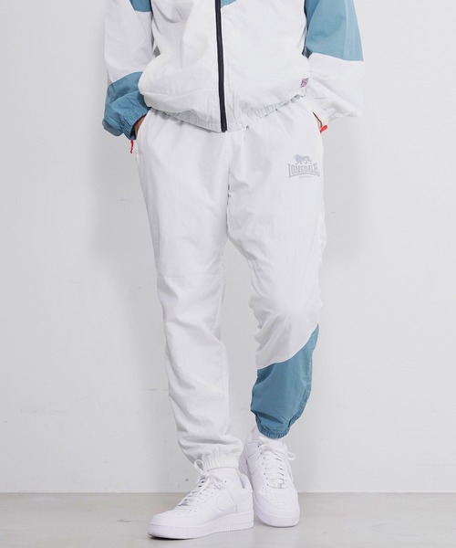 LONSDALE(ロンズデール)の「LONSDALE/ロンズデール リフレクタープリント ポケット付き 裏メッシュ クレイジー切替 ナイロン トレーニングパンツ トラックパンツ(その他パンツ・メンズ・ホワイト/ブラック/ブルーグリーン・LL/M/L)」の4枚目の写真