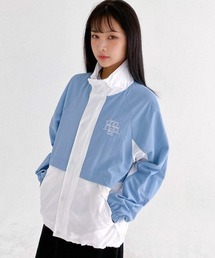 muahmuah（ムーアムーア）の「A'GEM/9 × .kom『muah muah/ムーアムーア』MUAH COMBI WINDBREAKER JACKET/コンビ テープライン ウィンドブレイカー（ブルゾン）」