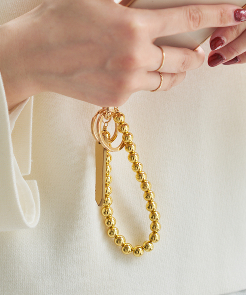 Spick & Span(スピックアンドスパン)の「HASHIBAMI / ハシバミ ヘマタイトボールスマホストラップ(その他小物・レディース・ゴールド/シルバー・FREE)」の1枚目の写真