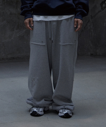 TONY LAWRENCE（トニーローレンス）の「ワイドシンボルロゴスウェットパンツメランジェグレー（スウェットパンツ）」