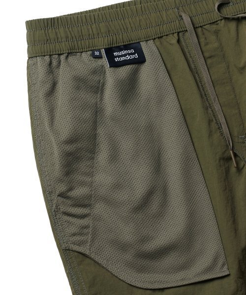 MUSINSA STANDARD（ムシンサスタンダード）の「ナイロンバンディングショーツ_7.5インチ [オリーブグリーン]（その他パンツ・メンズ・その他・38/36/34/32/30/26/28）」の5枚目の写真