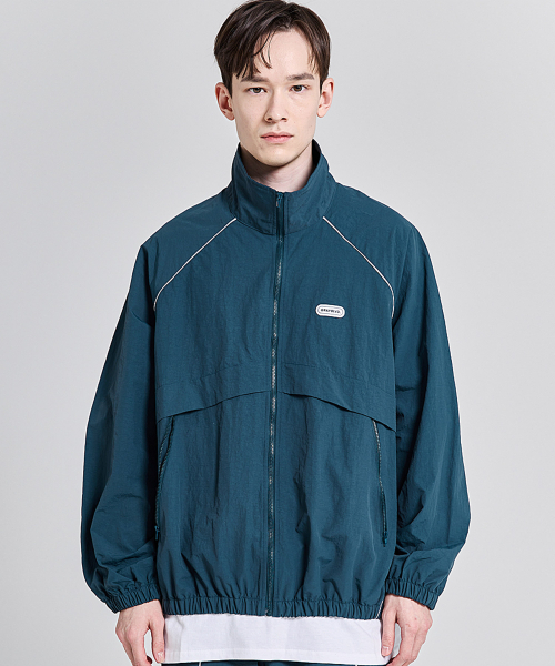 GRAYBLVD（グレイブラバット）の「バスツ パイピング ウィンドブレーカー (ブルーグリーン)（ナイロンジャケット・レディース・その他・MEDIUM/LARGE）」の4枚目の写真