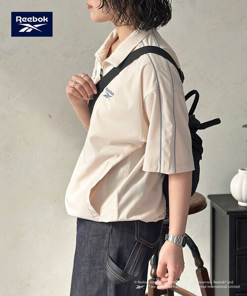 Reebok(リーボック)の「【Reebok】半袖トラックジャケット(ブルゾン・レディース・アイボリー/チャコールグレー/ネイビー・MEDIUM/LARGE)」の8枚目の写真