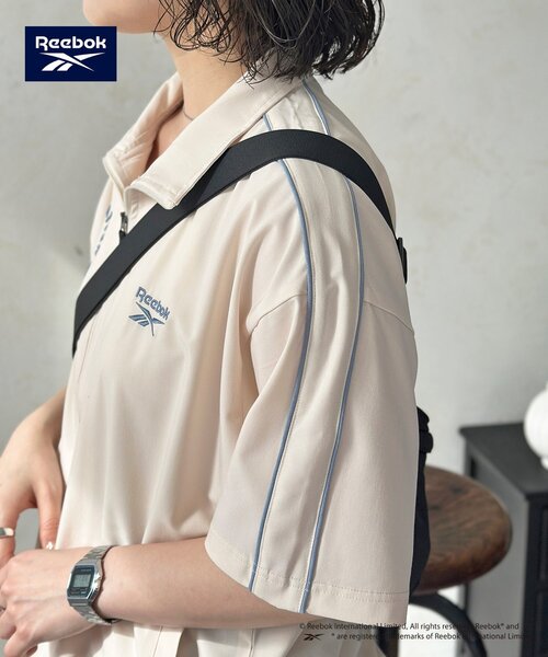 Reebok(リーボック)の「【Reebok】半袖トラックジャケット(ブルゾン・レディース・アイボリー/チャコールグレー/ネイビー・MEDIUM/LARGE)」の11枚目の写真