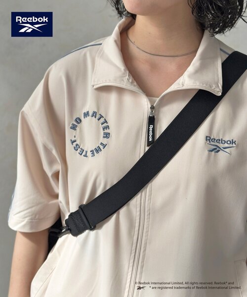 Reebok(リーボック)の「【Reebok】半袖トラックジャケット(ブルゾン・レディース・アイボリー/チャコールグレー/ネイビー・MEDIUM/LARGE)」の12枚目の写真