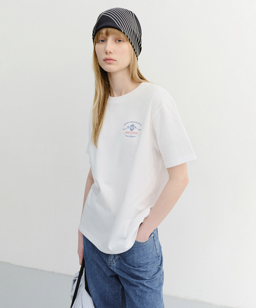 DUNST(ダンスト)の「UNISEX CUPID ARCH BACK LOGO T-SHIRT_UDTS6B128_OFF WHITE(Tシャツ/カットソー・レディース・Off White・MEDIUM/LARGE/X-LARGE/XX-LARGE/X-SMALL/SMALL)」の1枚目の写真