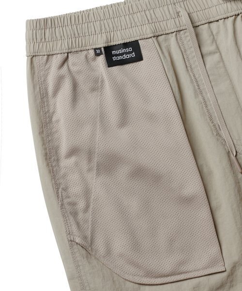 MUSINSA STANDARD（ムシンサスタンダード）の「ナイロンバンディングショーツ_7.5インチ [ライトベージュ]（その他パンツ・メンズ・その他・38/36/34/32/30/26/28）」の5枚目の写真