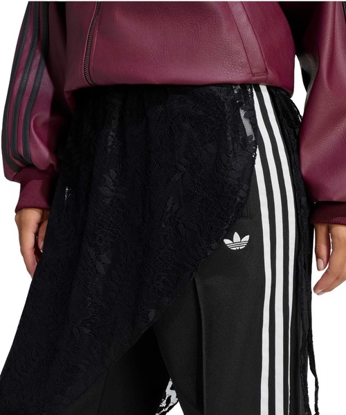 adidas(アディダス)の「adidas 2IN1 FIREBIRD LOOSE TRACK TROUSERS WITH LACE SKIRT / アディダス レーススカート付き 2イン1 ファイヤーバード ルーズ トラックパンツ(その他パンツ・レディース・ブラック・S/M/L)」の3枚目の写真
