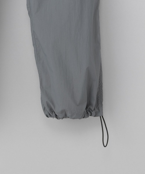 NUMERALS（ヌメラルズ）の「[NUMERALS]ナイロントラックパンツ（その他パンツ・メンズ・ブラック/チャコール・MEDIUM/LARGE）」の7枚目の写真