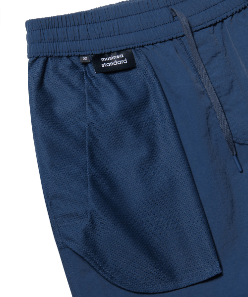 MUSINSA STANDARD（ムシンサスタンダード）の「ナイロンバンディングショーツ_5.5インチ [ダスティブルー]（その他パンツ・メンズ・その他・28/30/32/36/34）」の5枚目の写真