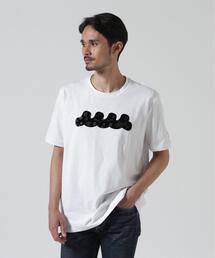 muta marine（ムータ・マリン）の「muta MARINE ムータ マリン 別注フロッキーWAVE Tシャツ（Tシャツ/カットソー）」