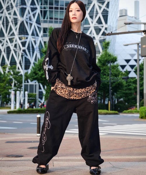 A'GEM/9 × .kom 『A'GEM/9/エージェムナイン』クロスロゴトレーナー