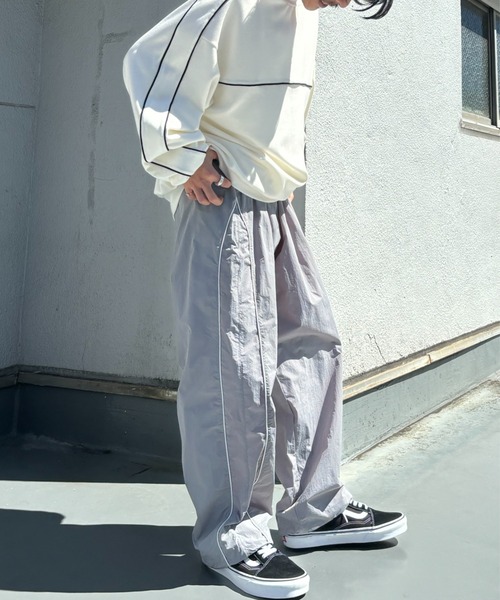 CREARE -LINO-（クレアーレリノ）の「パイピング ナイロン ルーズ パンツ<ユニセックス>（その他パンツ・メンズ・ブラック/カーキ/グレー・M/L）」の3枚目の写真