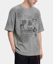 ARULE（アルール）の「A'GEM/9 × .kom『ARULE/アルール』サーマル 加工プリント半袖Tシャツ（Tシャツ/カットソー）」