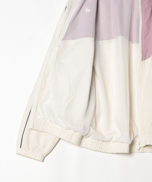 le coq sportif(ルコックスポルティフ)の「【はっ水】ナイロンワッシャーフルジップウィンドジャケット(ナイロンジャケット・レディース・ホワイト/グリーン・L/M/S/XL)」の17枚目の写真