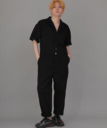 SAINTCREW（セントクルー）の「Center Button & Zip-Up Tapered Short-Sleeve Jumpsuit CBZ-513 Black（つなぎ/オールインワン・メンズ）」