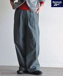 COURO（コウロ）の「【Reebok/リーボック】 別注 スモールベクター刺繍ナイロンパンツ（その他パンツ）」