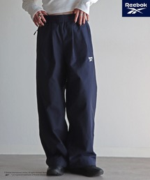 COURO（コウロ）の「【Reebok/リーボック】 別注 スモールベクター刺繍ナイロンパンツ（その他パンツ）」