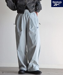COURO（コウロ）の「【Reebok/リーボック】 別注 スモールベクター刺繍ナイロンパンツ（その他パンツ）」