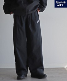 COURO（コウロ）の「【Reebok/リーボック】 別注 スモールベクター刺繍ナイロンパンツ（その他パンツ）」