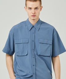 ease（イーズ）の「ユーティリティウィンド1/2シャツ_ブルー_男女共用（シャツ/ブラウス）」