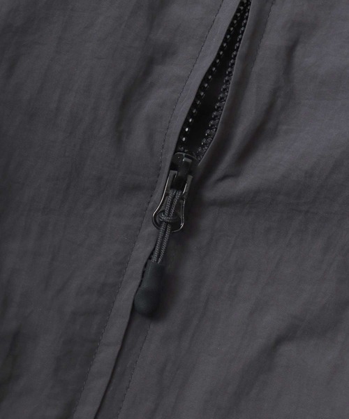 CONVERSE（コンバース）の「CONVERSE/コンバース 撥水 オーバーサイズ パイピング ナイロンジャケット/トラックジャケット/ブルゾン/レディース メンズ（ナイロンジャケット・レディース・ブラック/ネイビー/アイボリー・LL/M/L）」の21枚目の写真