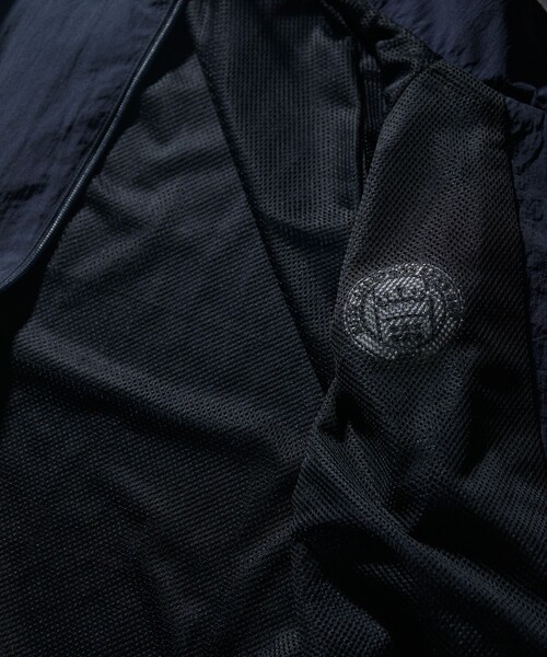 UMBRO（アンブロ）の「UMBRO/アンブロ 別注 Nylon Jacket/ナイロンジャケット（ブルゾン・メンズ・ブラック/ネイビー・MEDIUM/LARGE/X-LARGE）」の6枚目の写真
