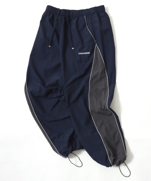 CONVERSE（コンバース）の「CONVERSE/コンバース 撥水 オーバーサイズ パイピング ナイロンパンツ/トラックパンツ/レディース メンズ（その他パンツ・レディース・ブラック/ネイビー/アイボリー・LL/L/M）」の3枚目の写真