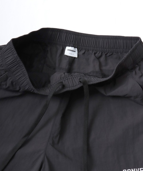 CONVERSE（コンバース）の「CONVERSE/コンバース 撥水 オーバーサイズ パイピング ナイロンパンツ/トラックパンツ/レディース メンズ（その他パンツ・レディース・ブラック/ネイビー/アイボリー・LL/L/M）」の14枚目の写真
