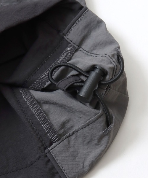 CONVERSE（コンバース）の「CONVERSE/コンバース 撥水 オーバーサイズ パイピング ナイロンパンツ/トラックパンツ/レディース メンズ（その他パンツ・レディース・ブラック/ネイビー/アイボリー・LL/L/M）」の21枚目の写真