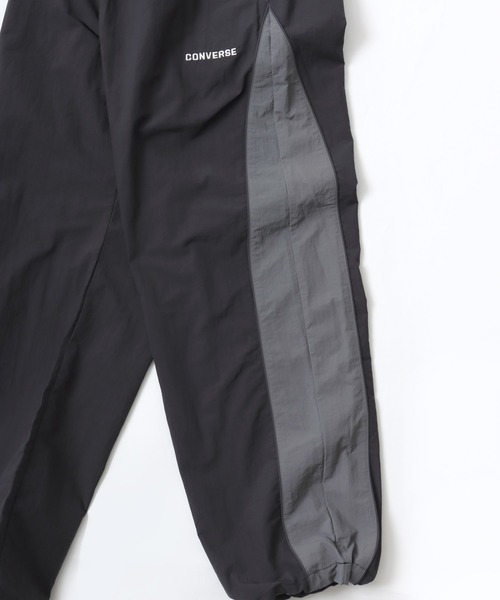 CONVERSE（コンバース）の「CONVERSE/コンバース 撥水 オーバーサイズ パイピング ナイロンパンツ/トラックパンツ/レディース メンズ（その他パンツ・レディース・ブラック/ネイビー/アイボリー・LL/L/M）」の17枚目の写真
