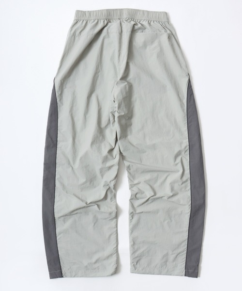 CONVERSE（コンバース）の「CONVERSE/コンバース 撥水 オーバーサイズ パイピング ナイロンパンツ/トラックパンツ/レディース メンズ（その他パンツ・レディース・ブラック/ネイビー/アイボリー・LL/L/M）」の8枚目の写真