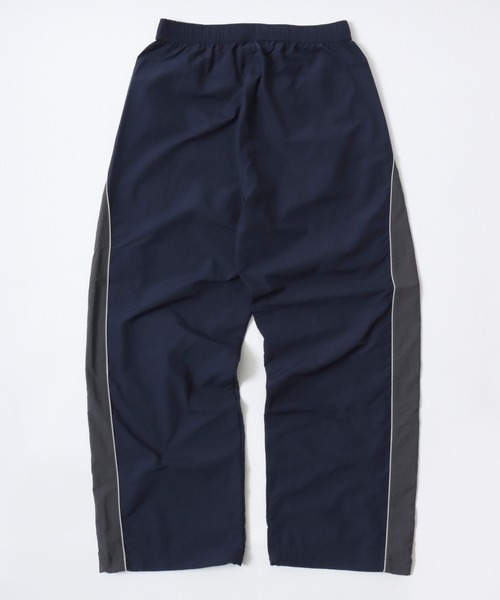 CONVERSE（コンバース）の「CONVERSE/コンバース 撥水 オーバーサイズ パイピング ナイロンパンツ/トラックパンツ/レディース メンズ（その他パンツ・レディース・ブラック/ネイビー/アイボリー・LL/L/M）」の12枚目の写真
