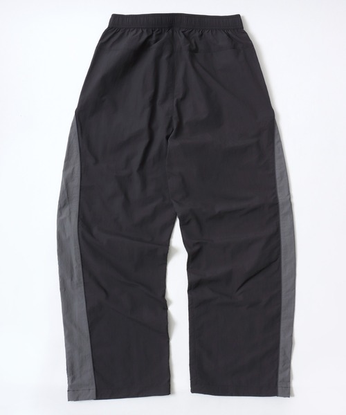 CONVERSE（コンバース）の「CONVERSE/コンバース 撥水 オーバーサイズ パイピング ナイロンパンツ/トラックパンツ/レディース メンズ（その他パンツ・レディース・ブラック/ネイビー/アイボリー・LL/L/M）」の10枚目の写真