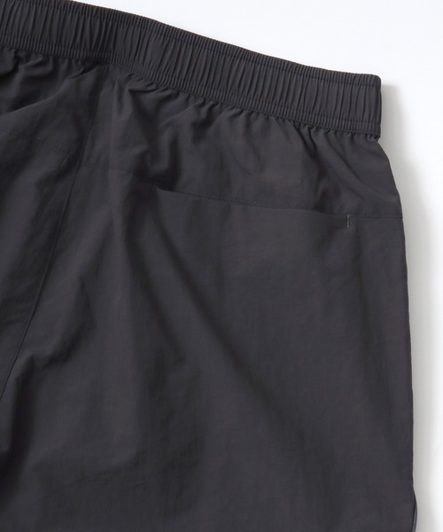 CONVERSE（コンバース）の「CONVERSE/コンバース 撥水 オーバーサイズ パイピング ナイロンパンツ/トラックパンツ/レディース メンズ（その他パンツ・レディース・ブラック/ネイビー/アイボリー・LL/L/M）」の16枚目の写真