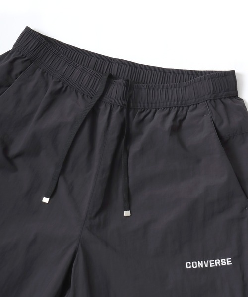 CONVERSE（コンバース）の「CONVERSE/コンバース 撥水 オーバーサイズ パイピング ナイロンパンツ/トラックパンツ/レディース メンズ（その他パンツ・レディース・ブラック/ネイビー/アイボリー・LL/L/M）」の13枚目の写真