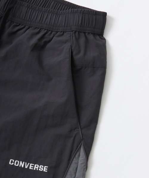 CONVERSE（コンバース）の「CONVERSE/コンバース 撥水 オーバーサイズ パイピング ナイロンパンツ/トラックパンツ/レディース メンズ（その他パンツ・レディース・ブラック/ネイビー/アイボリー・LL/L/M）」の15枚目の写真
