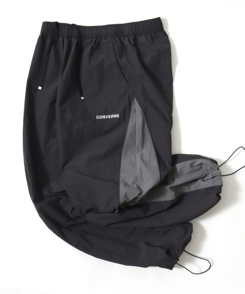 CONVERSE（コンバース）の「CONVERSE/コンバース 撥水 オーバーサイズ パイピング ナイロンパンツ/トラックパンツ/レディース メンズ（その他パンツ・レディース・ブラック/ネイビー/アイボリー・LL/L/M）」の5枚目の写真